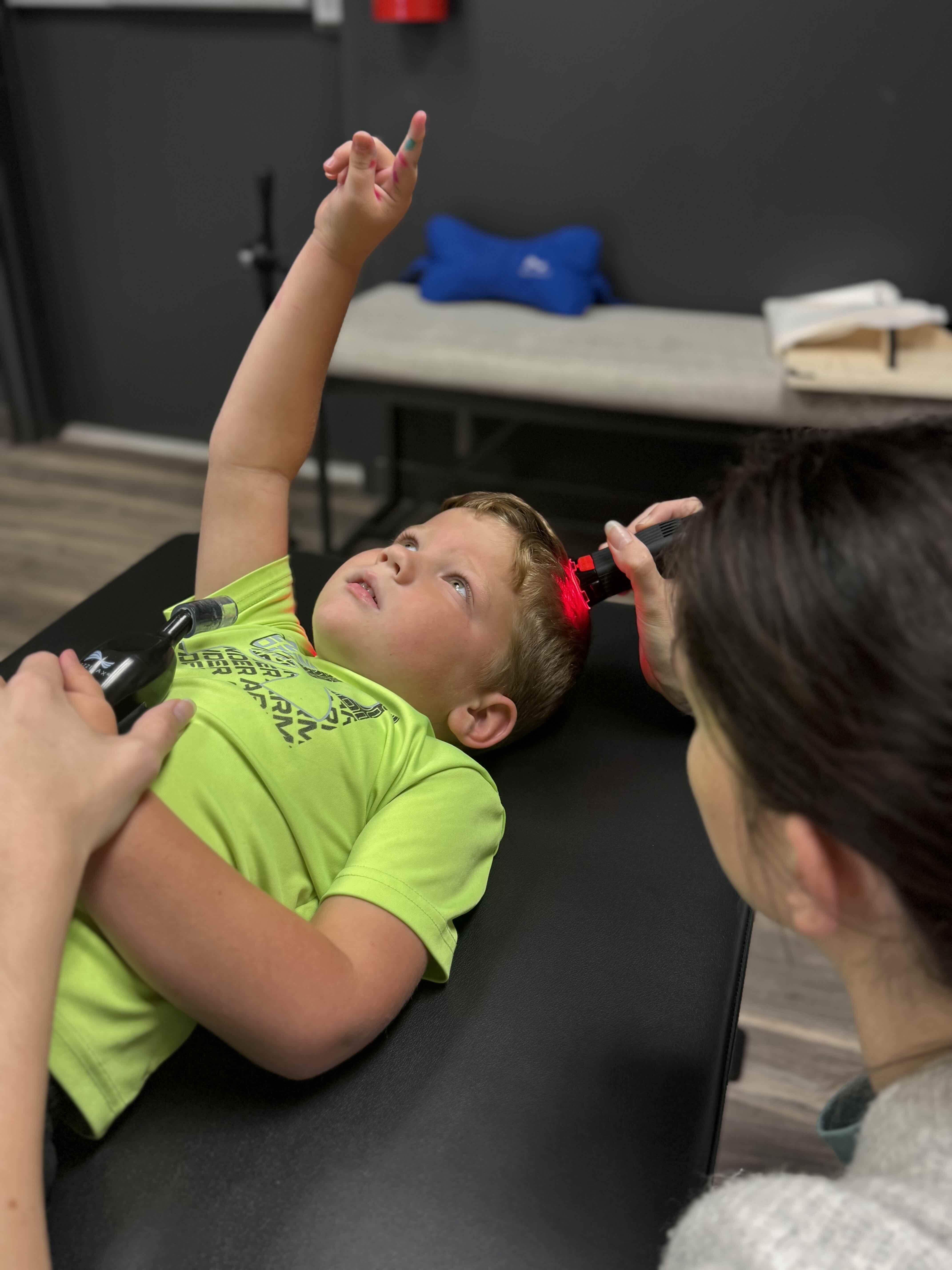 Child during clinical laser therapy session